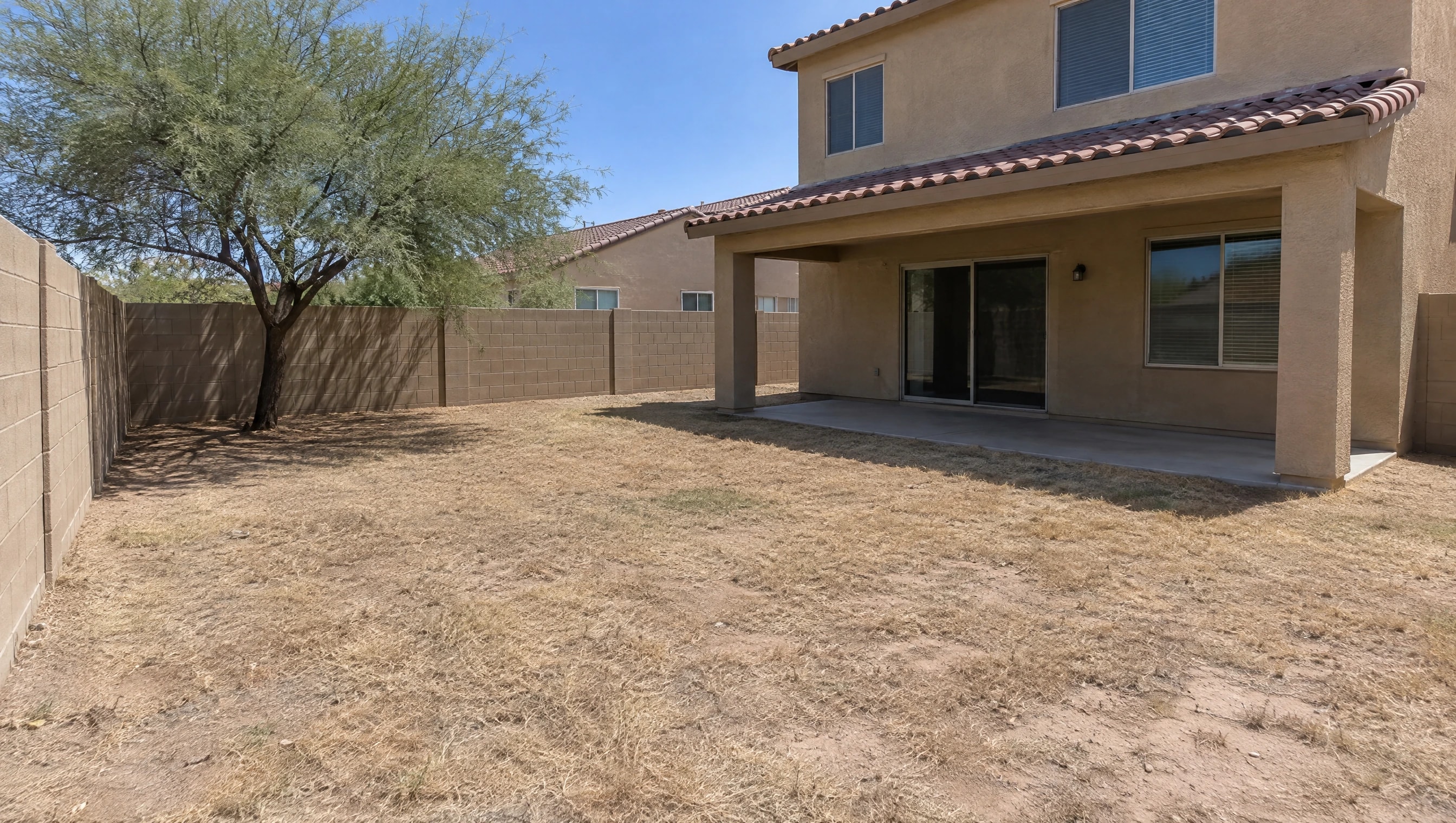 Before: Gilbert backyard, dead grass replaced with artificial turf